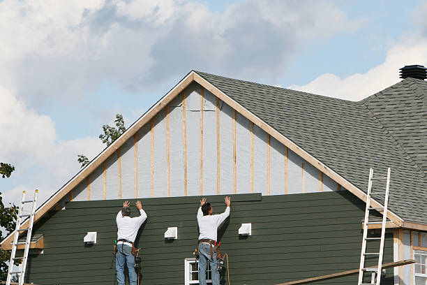 Professional Storm Damage Siding Repair technician working in New Brighton, MN